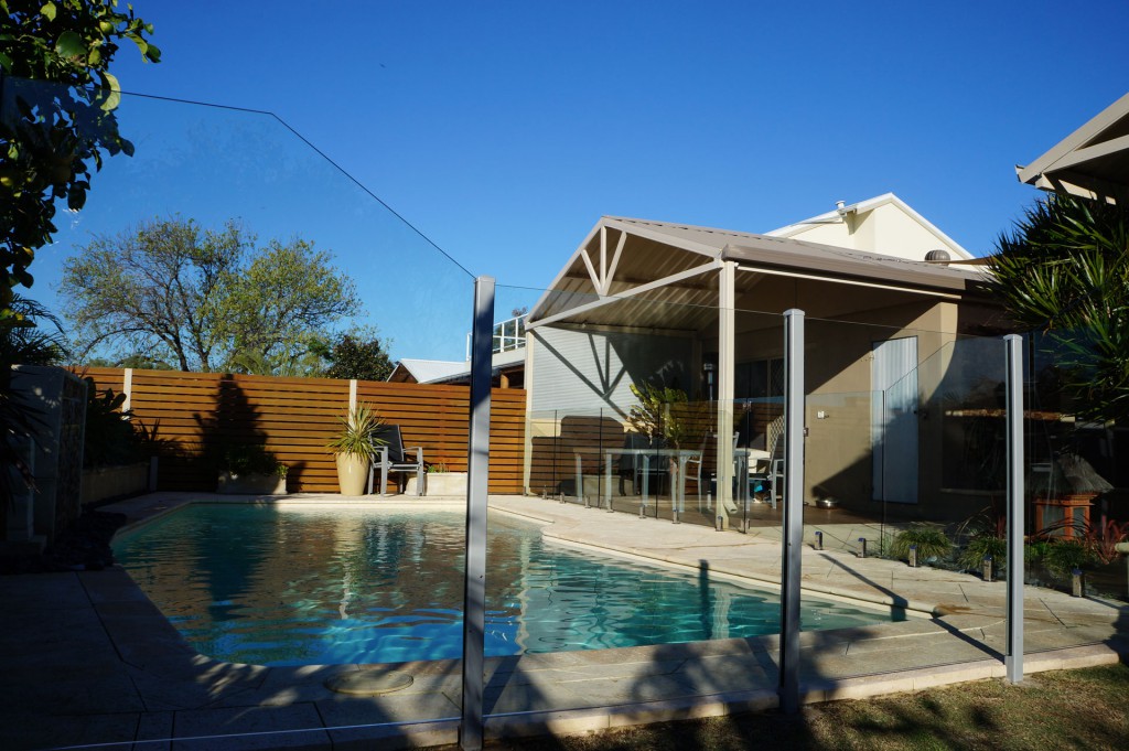 semi inground pool with fence